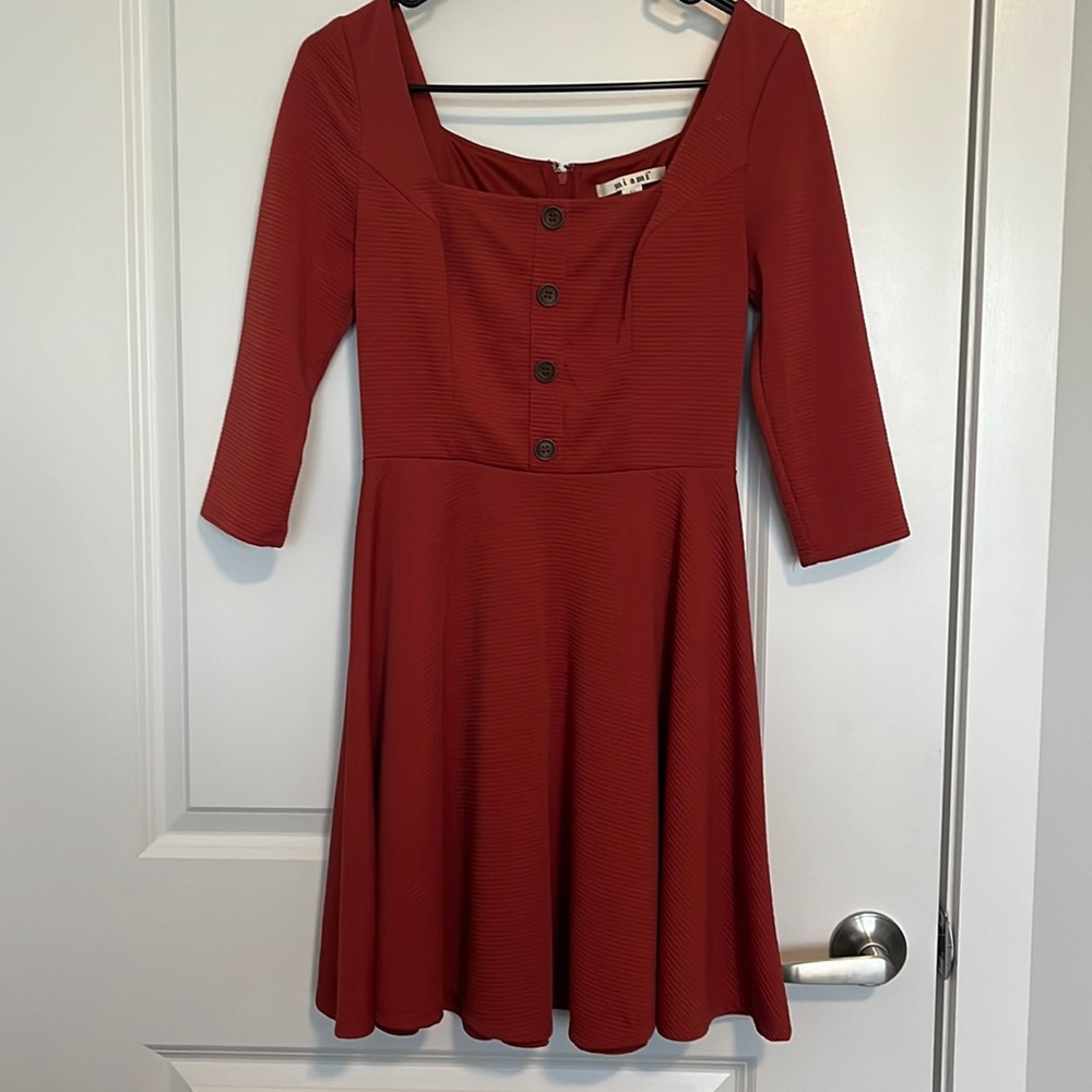 Francesca’s square neck dress in XS. Burnt orange color.